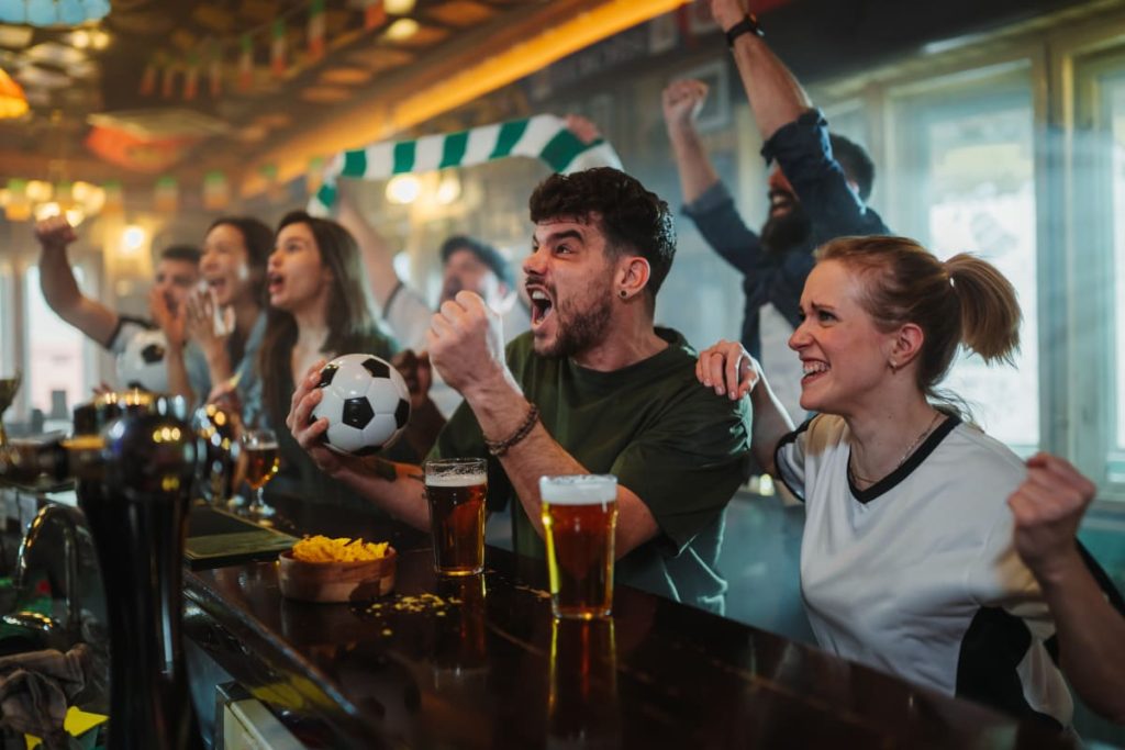 People watching WC 2026 in a bar