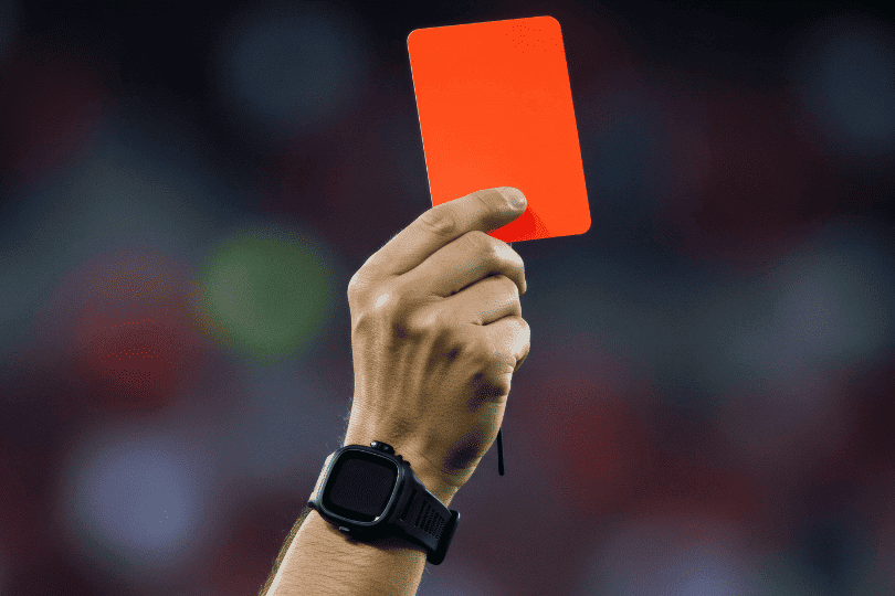 Football referee showing a red card